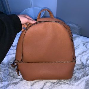 small light brown backpack pocketbook